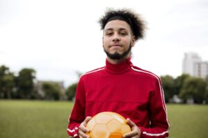 A man holding a football ball