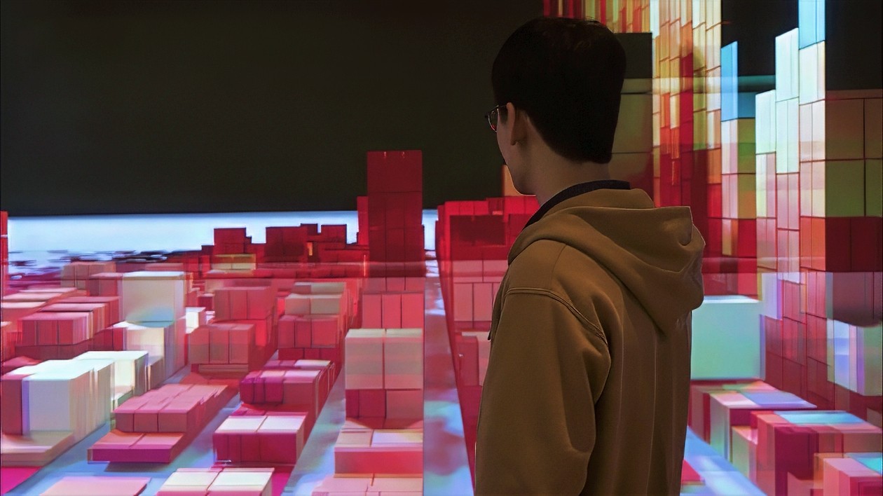 man standing and looking at a digital scene